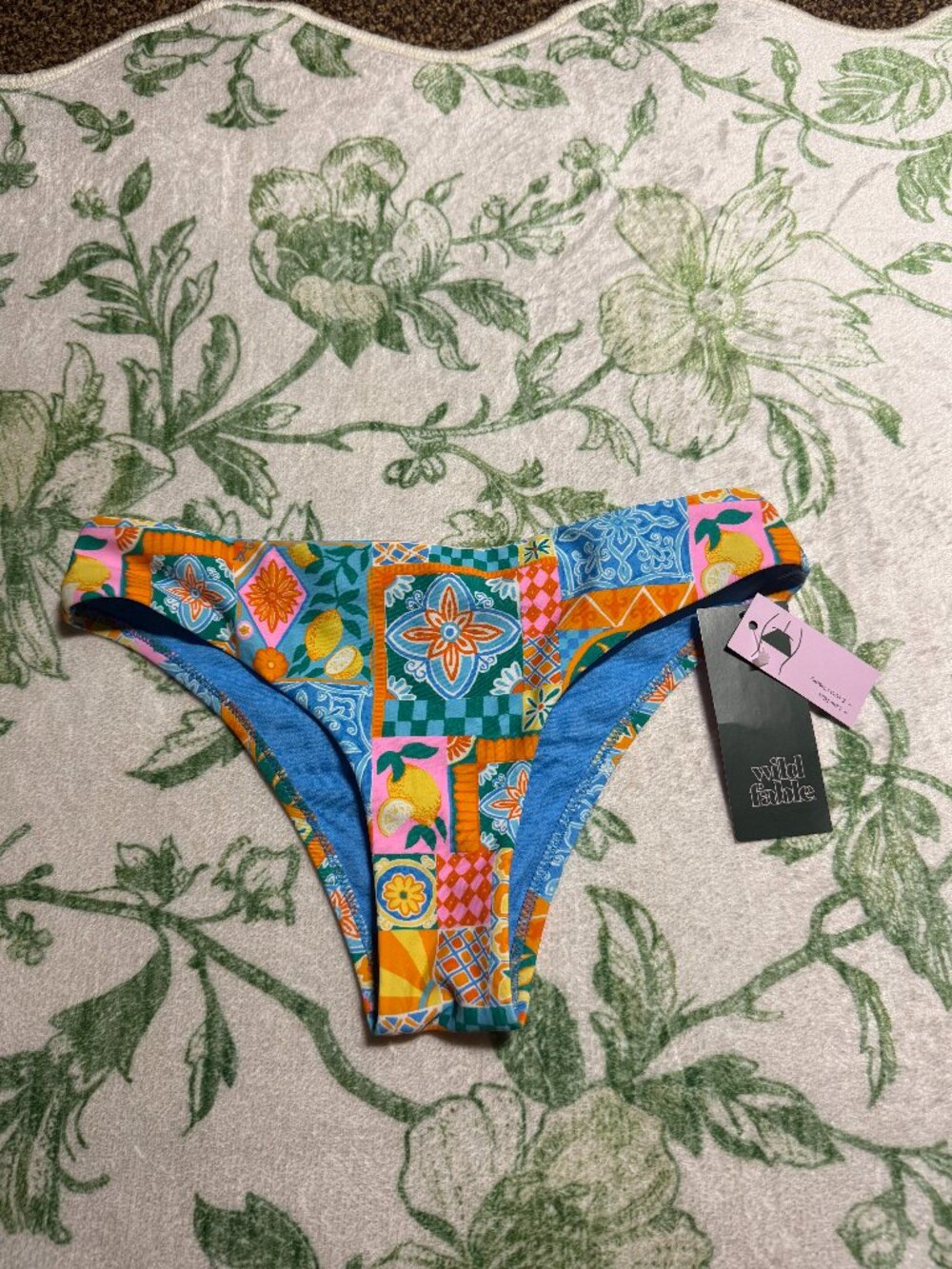 wild fable patterned bikini bottoms. orange, blue, yellow, green, pink pattern.